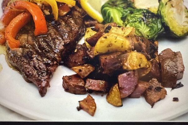Ostrich CUT steak with pomme fritte and grilled vegetables.